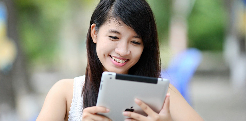 woman reading from a tablet